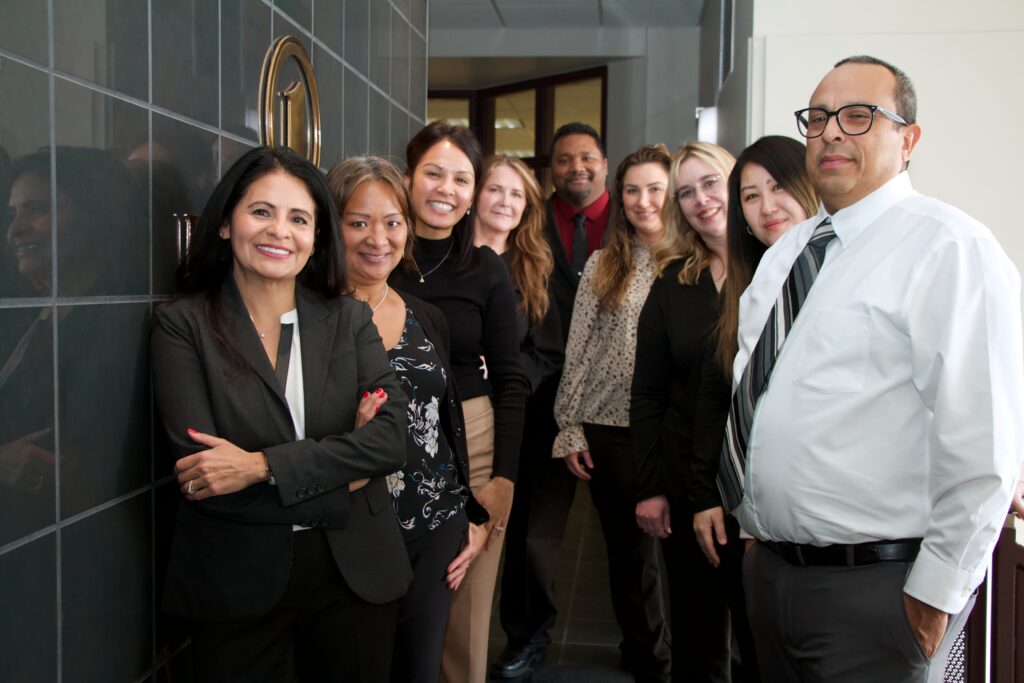 The First National Bank Alaska sales team poses together for a group portrait, highlighting their unity and professionalism.